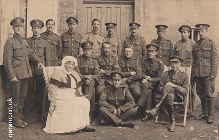 RAMC personnel on the Western Front with QAIMNS Reserve Staff Nurse holding bird