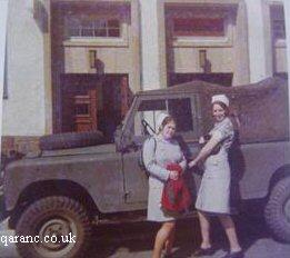 Two QA Nurse By Land Rover