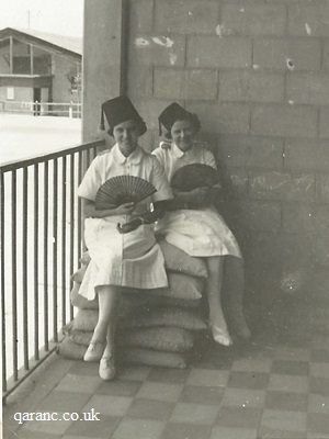 Fez Hats Worn Nurses Sitting On Sandbags Holding Fans