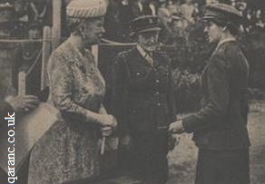 Queen Mary hands badge QAIMNS(R) to sister passing out Dame Louisa J Wilkinson Matron In Chief