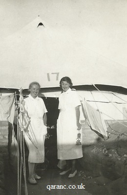 nurses holding tilly lamp outside tent WW2